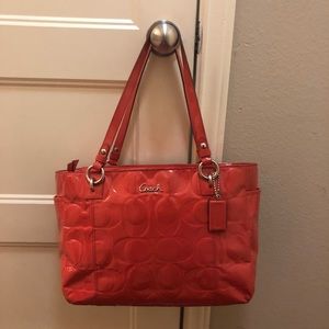 Salmon colored coach purse!